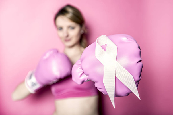 Fight for Breast Cancer woman with symbol on pink background - 写真・画像