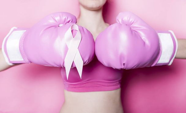 Fight for Breast Cancer woman with symbol on pink background - Foto, Imagen