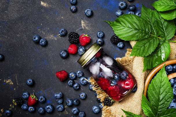 Cold refreshing berry drink with blueberries  - Φωτογραφία, εικόνα