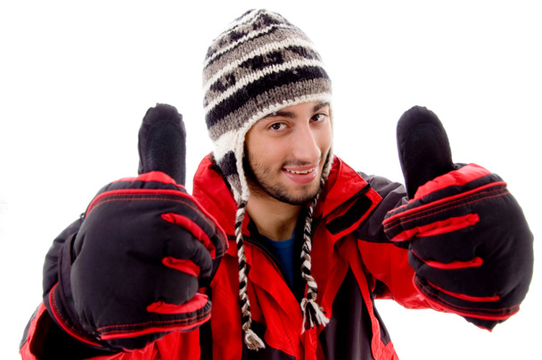 Young man in woolen outfit, thumbs up - Fotoğraf, Görsel