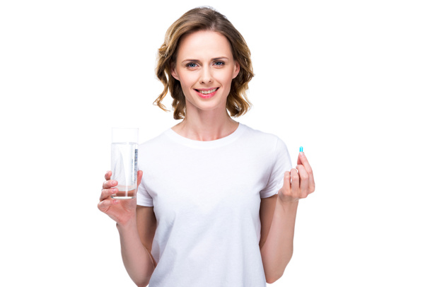 mulher com água e pílula
 - Foto, Imagem