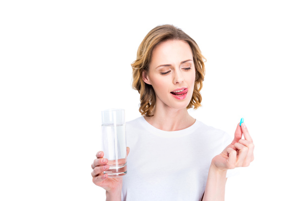 woman with glass of water and pill - Foto, Imagem
