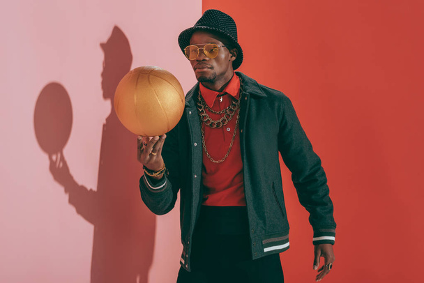 african american man with golden ball - Foto, afbeelding