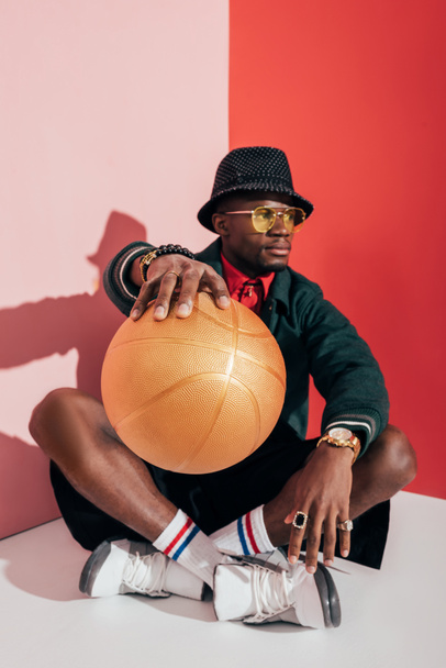 stylish african american man with ball - Zdjęcie, obraz