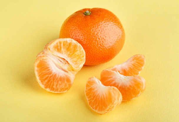 Ripe mandarin close-up on a white background. Tangerine orange. Colorful Food and drink still life concept. Fresh fruits and vegetables on color background. Clementine. Citrus. Fresh fruits. Diet. - Foto, immagini