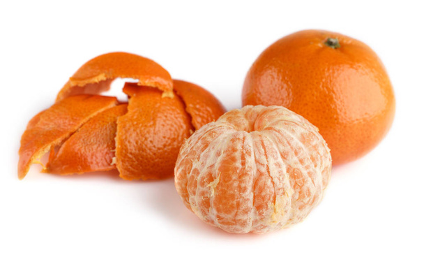 Ripe mandarin close-up on a white background. Tangerine orange. Colorful Food and drink still life concept. Fresh fruits and vegetables on color background. Clementine. Citrus. Fresh fruits. Diet. - Photo, Image
