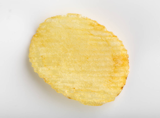 Batatas fritas crocantes. Fast Food. Batatas. Alimentos gordurosos e não saudáveis. aparas onduladas
 - Foto, Imagem