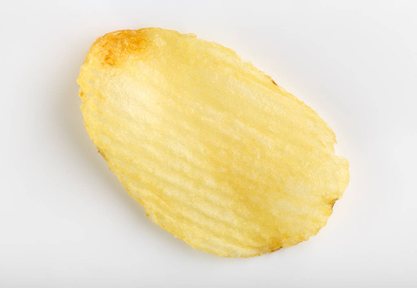 Batatas fritas crocantes. Fast Food. Batatas. Alimentos gordurosos e não saudáveis. aparas onduladas
 - Foto, Imagem
