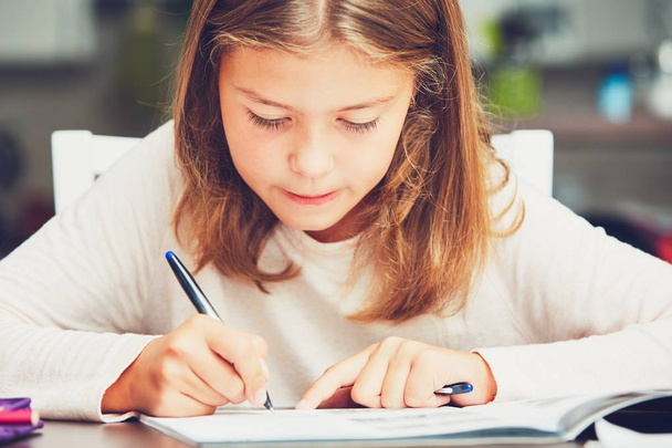 Little girl doing homework - Fotó, kép