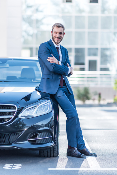 businessman at car on parking   - Foto, Bild