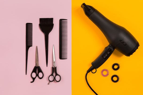 Combs and hairdresser tools on color background top view - Photo, Image