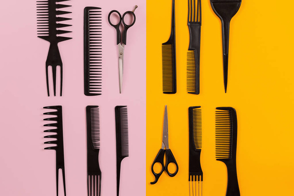 Hairdresser tools on pink and orange background with copy space - Photo, Image