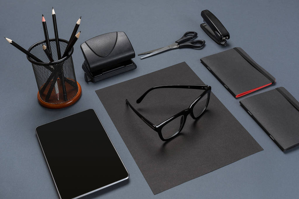 Black office stuff collection flat lay. Top view on set of stationery with tablet - Photo, Image