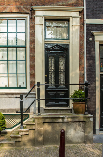 Traditional old buildings in Amsterdam - Foto, afbeelding