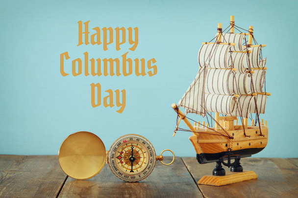 Columbus day concept with old ship over wooden background - Foto, Bild