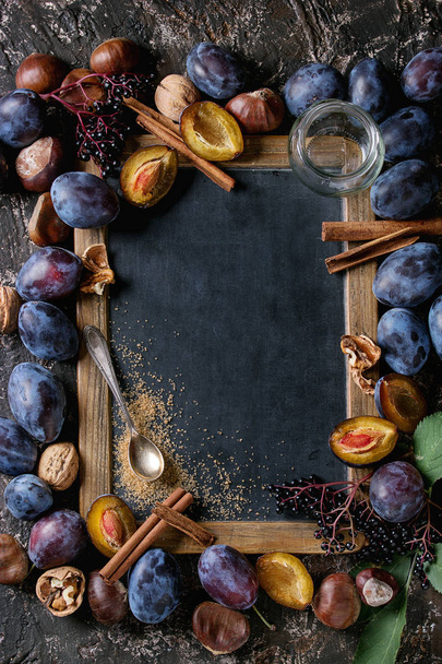 Plums and walnuts with chalkboard - Foto, Imagen