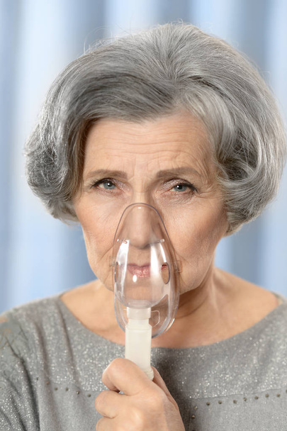 senior woman with inhaler - Fotó, kép