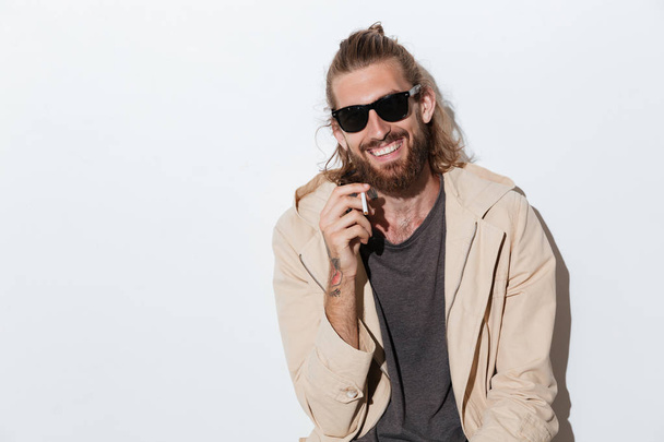 Cheerful hipster man looking camera isolated - Foto, Imagen