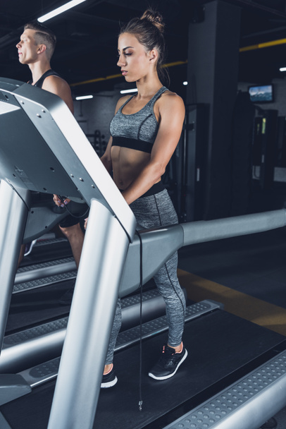athletic woman exercising on treadmill - Photo, Image
