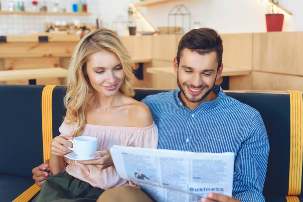 couple with newspaper and coffee - Zdjęcie, obraz