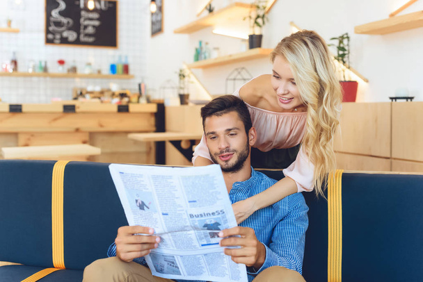 couple reading newspaper - 写真・画像