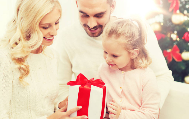 happy family at home with christmas gift box - Zdjęcie, obraz