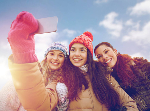 happy teenage girls taking selfie with smartphone - Photo, image