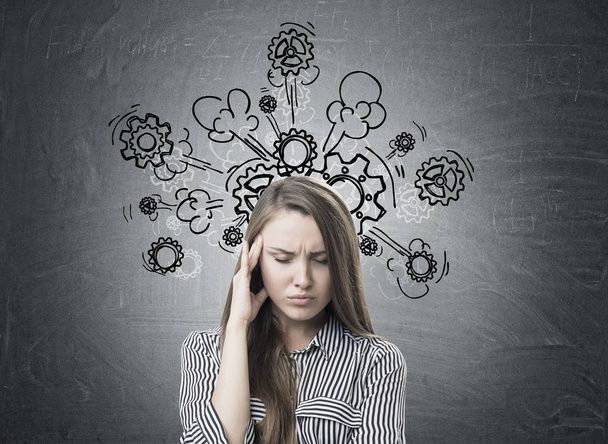 Stressed businesswoman, headache, cogs and gears - Фото, зображення