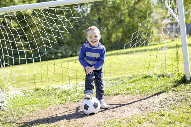 boy with soccer ball in park - Fotoğraf, Görsel