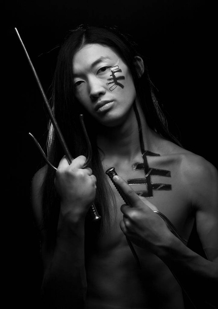 asian boy with weapons - Foto, Imagen