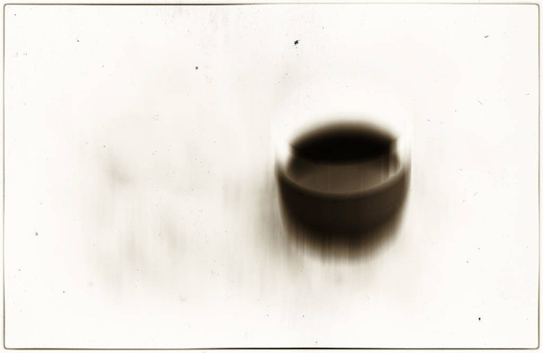 Horizontal vivid sepia coffee cup blur abstraction background - 写真・画像