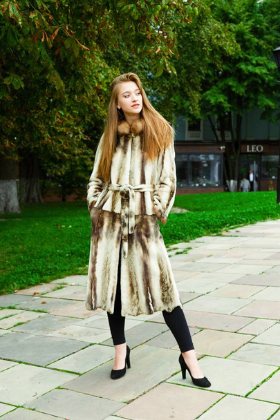 young woman in fur coat  - 写真・画像