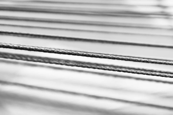 Diagonal black and white rope bokeh backdrop - Photo, Image