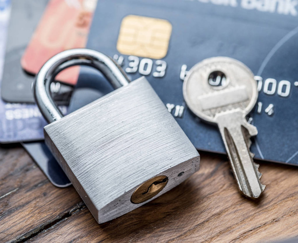 Credit cards and simle mechanical lock. - Fotó, kép