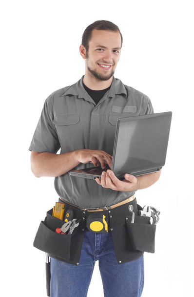 Carpinteiro trabalhando com laptop
 - Foto, Imagem