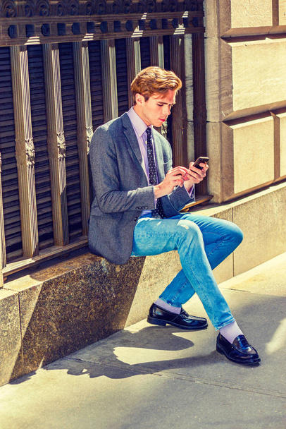 Young  American Man Texting outside under sunshine - Foto, Bild