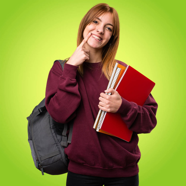 Happy student woman on colorful background - Photo, Image