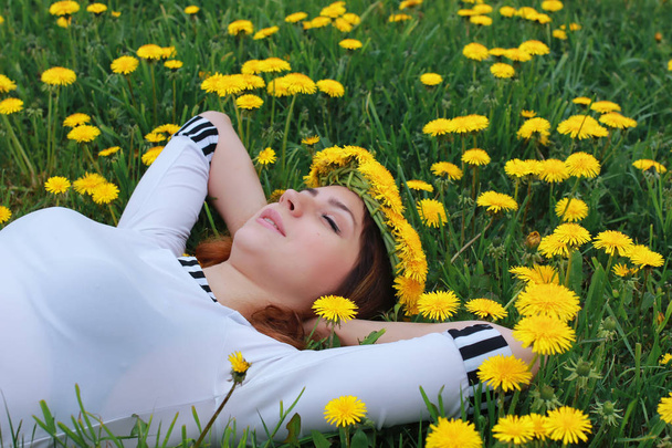 woman on ground dandelion meadow - Photo, Image