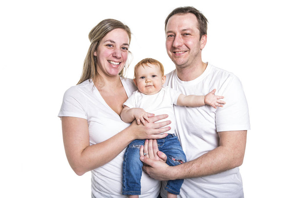 Happy young family with baby in studio white background - Фото, изображение