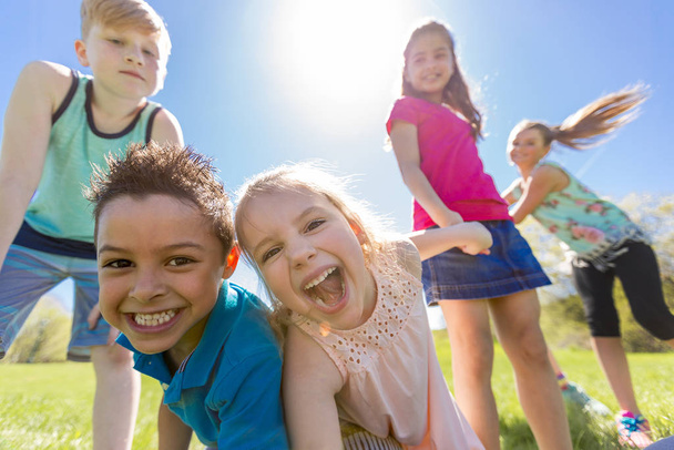 Group of child have fun on a field - Foto, Imagen