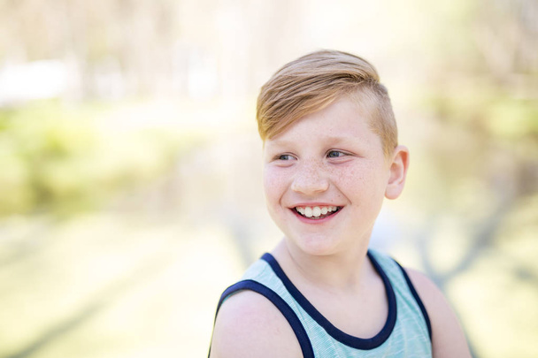 Young redheaded boy playing outside - Foto, Imagen