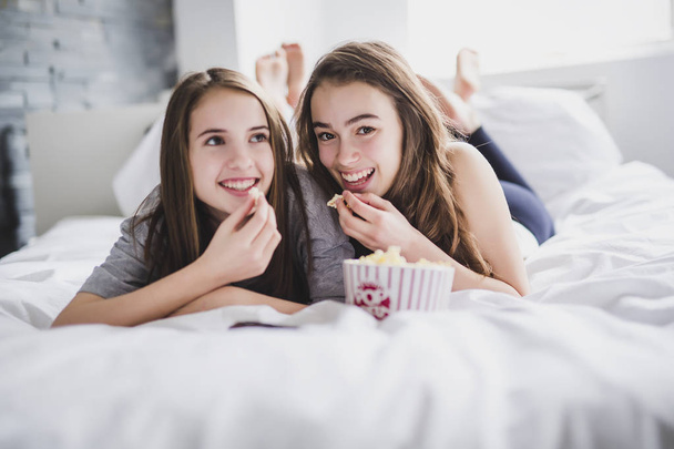 friendship, people, pajama party, entertainment and junk food concept - Фото, зображення