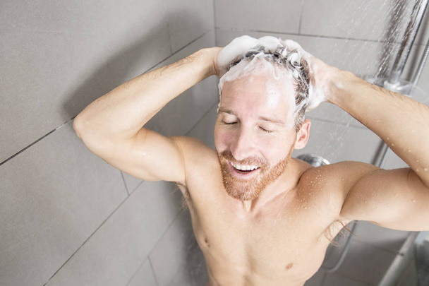 Handsome man in shower - Fotó, kép