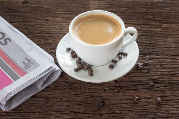 A cup of coffee and a newspaper  - Foto, immagini