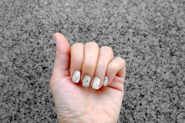 Hand and Nail Polish, Manicure Nail. Close Up Granite Gray Nails on Granite Background - Photo, Image