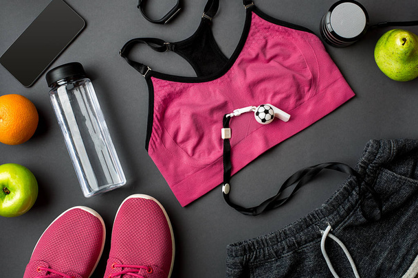 Sports accessories for fitness on the dark floor. Healthy lifestyle concept. - Fotoğraf, Görsel
