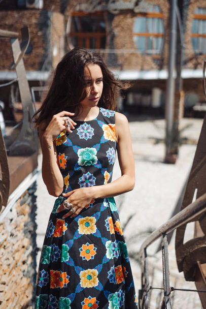 Young girl in a dress posing on a street - Foto, imagen