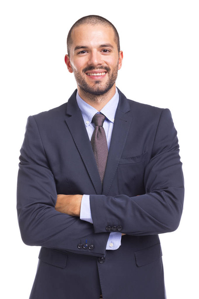 Handsome smiling businessman with arms crossed - Photo, Image