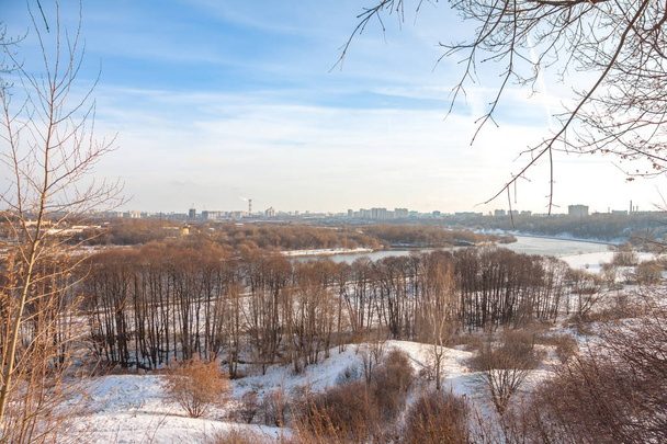 View of the Moskva river and Kolomenskoe park in winter day from the hill - Photo, Image