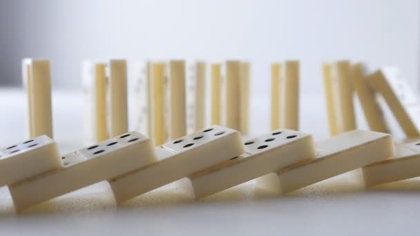 White Dominoes Falling in Chain Reaction - Footage, Video